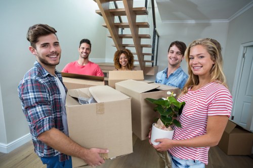 Local Barnet moving team preparing household furniture for transport