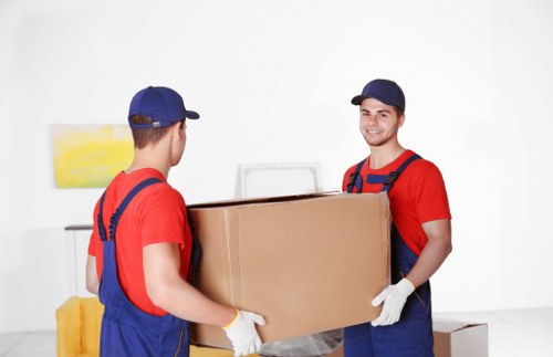 Local house removals service in Barnet handling boxes carefully