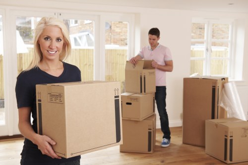 Removal team loading household items for a UK moving service